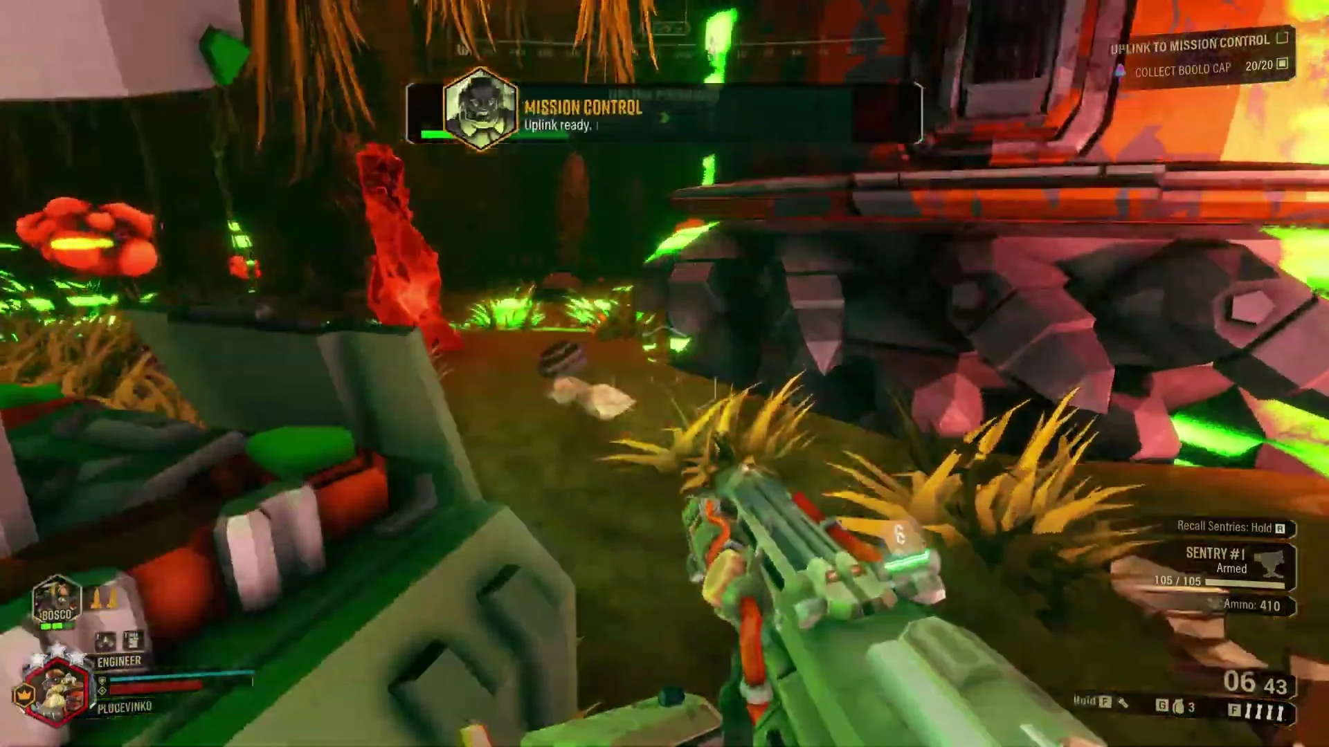 An Engineer holds a position inside a colourful alien cave in Deep Rock Galactic.