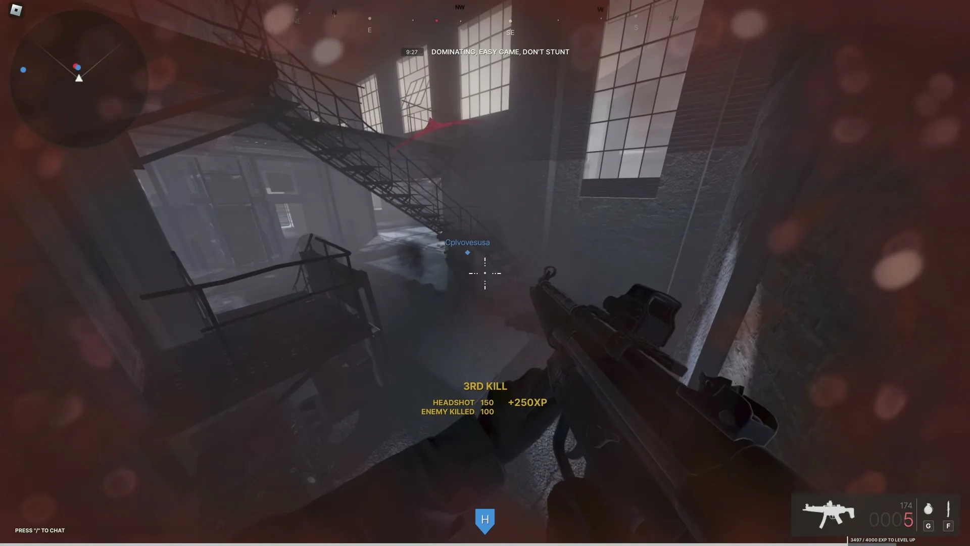 An angled rifle and a hand occupy the foreground during a FRONTLINES reload, with a warehouse stairway behind them.