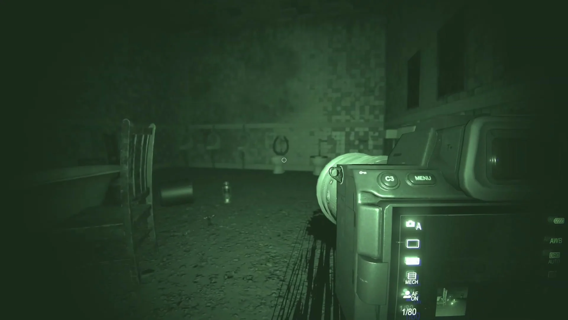 Night-vision equipment reveals a dark interior in Phasmophobia.